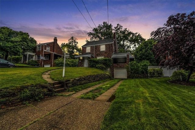 142 Slater Dr, Pleasant Hills, PA 15236 - yard at dusk with a garage and driveway