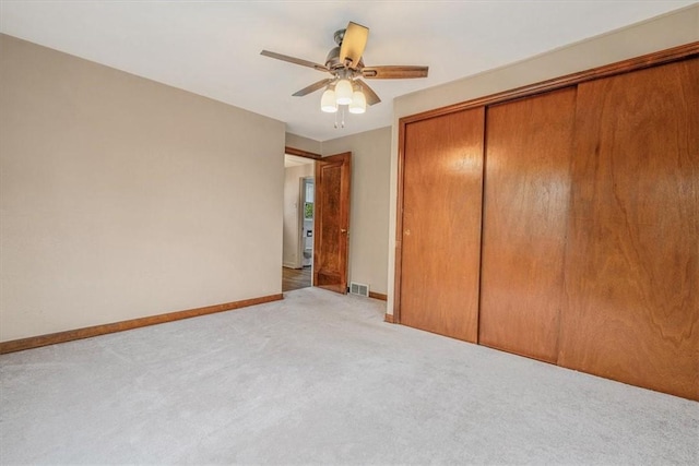 142 Slater Dr, Pleasant Hills, PA 15236 - unfurnished bedroom with light colored carpet, a closet, baseboards, and a ceiling fan