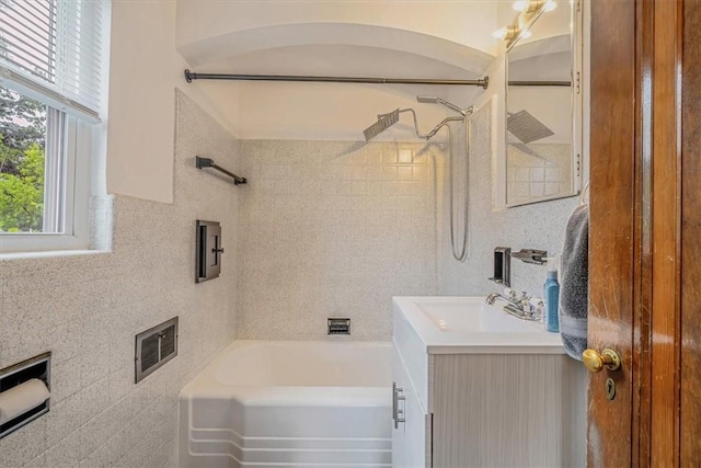 142 Slater Dr, Pleasant Hills, PA 15236 - bathroom featuring vanity, washtub / shower combination, and tile walls