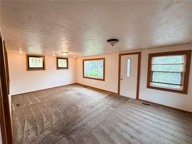 2701 Lafayette St, Mckeesport, PA 15132 - empty room featuring baseboards, carpet flooring, and a textured ceiling