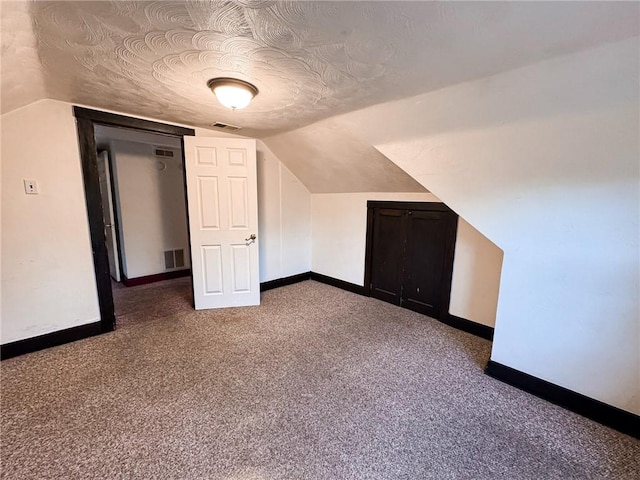 2701 Lafayette St, Mckeesport, PA 15132 - additional living space with baseboards, vaulted ceiling, and carpet
