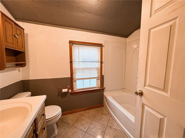 2701 Lafayette St, Mckeesport, PA 15132 - full bath with toilet, vanity, tile patterned flooring, a textured ceiling, and lofted ceiling