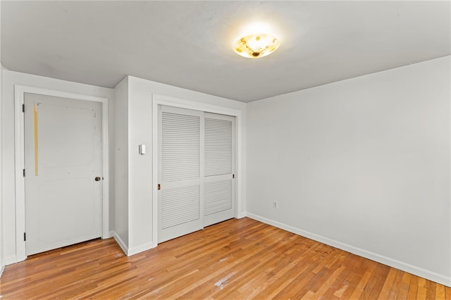 48 Green Crescent Dr, South Strabane, PA 15301 - unfurnished bedroom featuring baseboards, light wood-type flooring, and a closet
