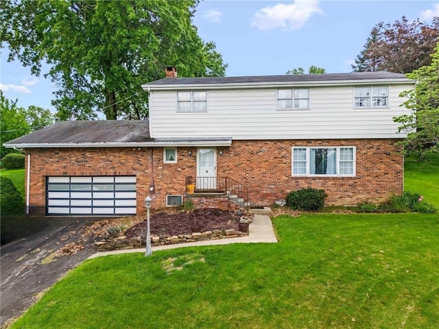 48 Green Crescent Dr, South Strabane, PA 15301 - view of front of home featuring brick siding, a front lawn, and asphalt driveway