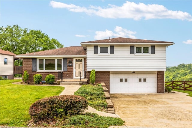 719 12th St, Pitcairn, PA 15140 - tri-level home with brick siding, an attached garage, concrete driveway, and a shingled roof