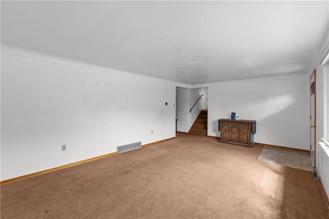 719 12th St, Pitcairn, PA 15140 - unfurnished living room with carpet floors, stairway, and baseboards