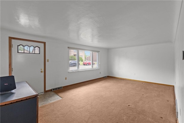 719 12th St, Pitcairn, PA 15140 - entrance foyer with light carpet and baseboards