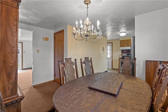 719 12th St, Pitcairn, PA 15140 - carpeted dining room with a chandelier, baseboards, and wallpapered walls