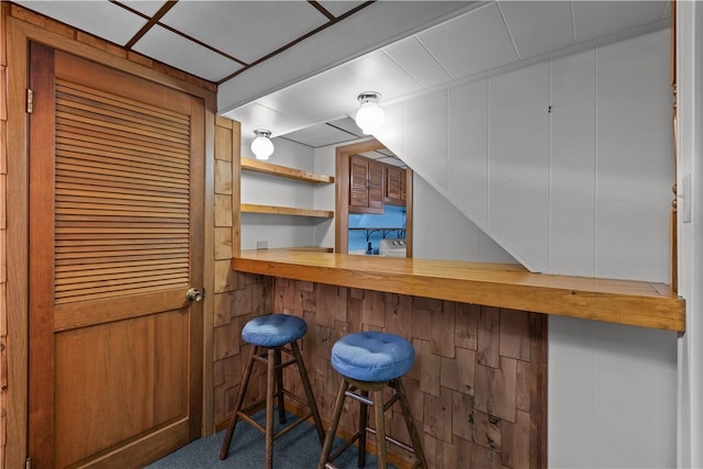 719 12th St, Pitcairn, PA 15140 - indoor dry bar featuring carpet flooring