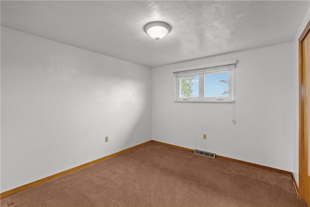719 12th St, Pitcairn, PA 15140 - carpeted empty room with baseboards