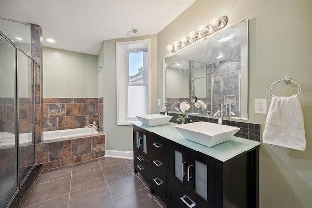 5822 Rippey St, East Liberty, PA 15206 - bathroom with double vanity, a garden tub, tile patterned floors, a stall shower, and baseboards