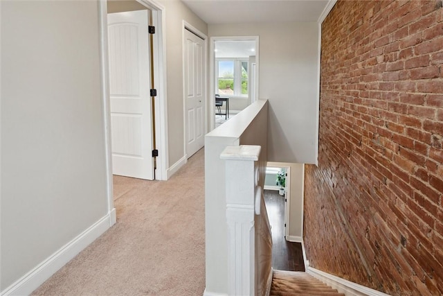5822 Rippey St, East Liberty, PA 15206 - corridor with an upstairs landing, brick wall, and baseboards