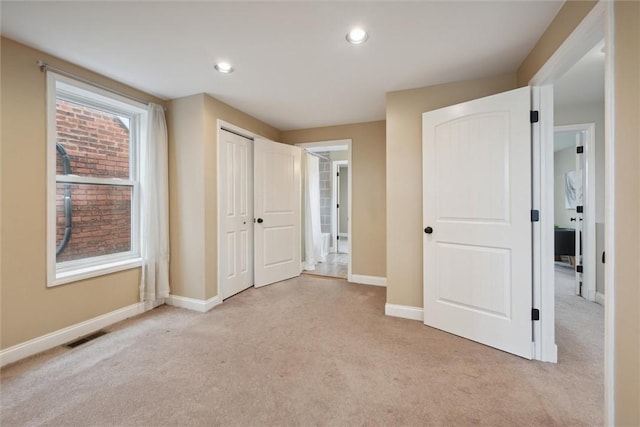 5822 Rippey St, East Liberty, PA 15206 - unfurnished bedroom with light carpet, baseboards, recessed lighting, and a closet