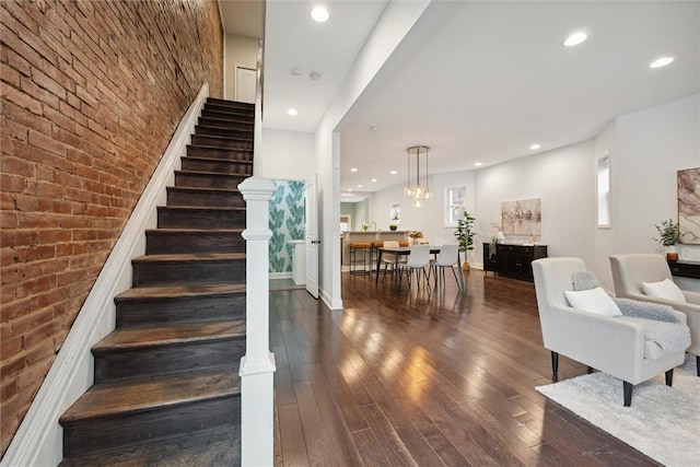 5822 Rippey St, East Liberty, PA 15206 - stairway with brick wall, hardwood / wood-style flooring, recessed lighting, and baseboards