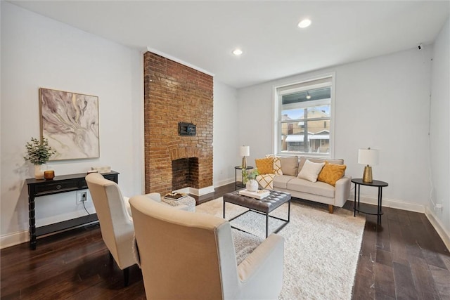 5822 Rippey St, East Liberty, PA 15206 - living area with dark wood finished floors, baseboards, recessed lighting, and a fireplace