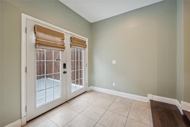 5822 Rippey St, East Liberty, PA 15206 - doorway featuring french doors, baseboards, and light tile patterned flooring