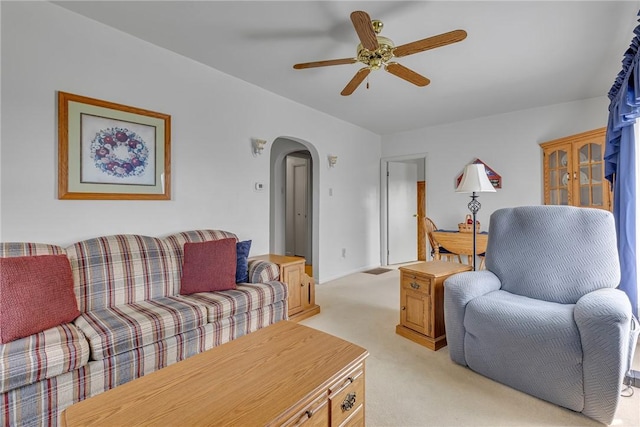 332 Division Ln, Vanport, PA 15009 - living room with light carpet, arched walkways, a ceiling fan, and baseboards