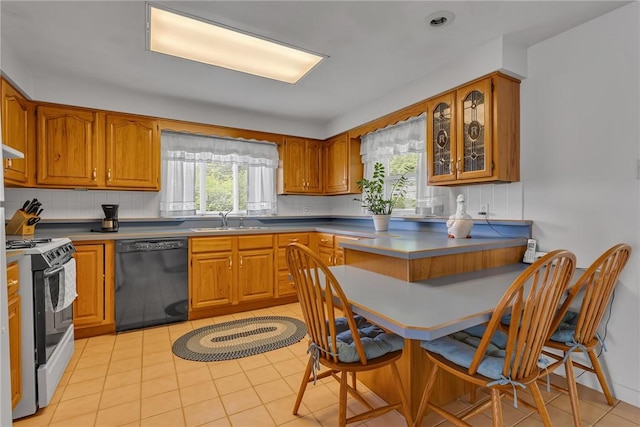 332 Division Ln, Vanport, PA 15009 - kitchen with black dishwasher, range, a sink, and brown cabinets