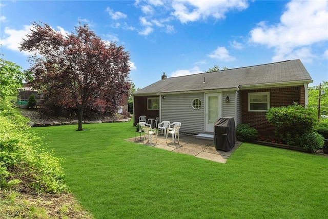 332 Division Ln, Vanport, PA 15009 - back of property with a patio, a lawn, brick siding, and roof with shingles