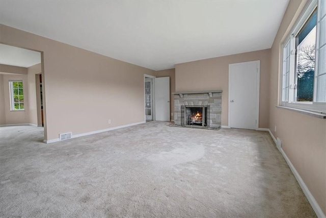 115 Norrington Dr, South Park, PA 15236 - unfurnished living room featuring carpet flooring, a stone fireplace, and baseboards
