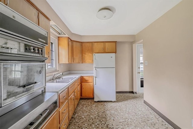 115 Norrington Dr, South Park, PA 15236 - kitchen featuring freestanding refrigerator, a sink, light countertops, light tile patterned floors, and baseboards