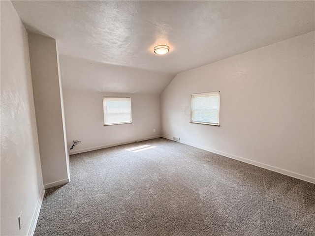 3021 Myer Blvd, Mckeesport, PA 15132 - spare room with carpet flooring, vaulted ceiling, and baseboards