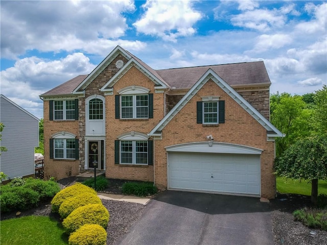8014 Maureen Dr, Cranberry Twp, PA 16066 - view of front of property featuring asphalt driveway, brick siding, and roof with shingles