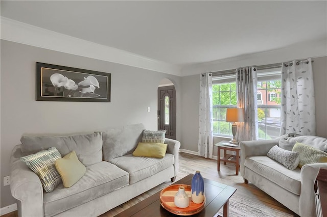 8014 Maureen Dr, Cranberry Twp, PA 16066 - living area featuring arched walkways, wood finished floors, and baseboards