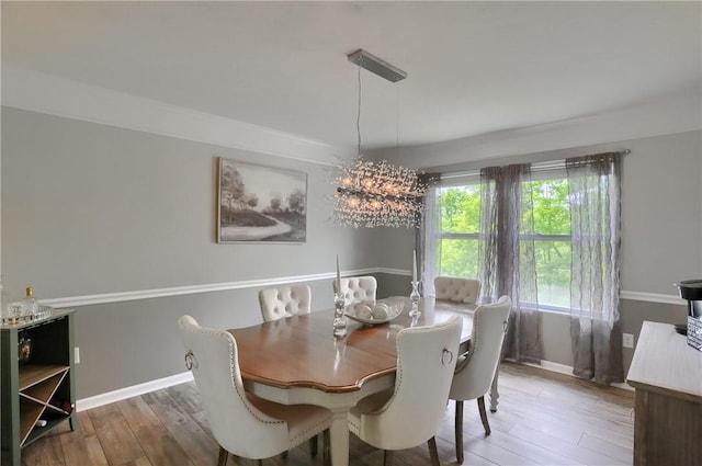 8014 Maureen Dr, Cranberry Twp, PA 16066 - dining space featuring wood finished floors, baseboards, and a chandelier