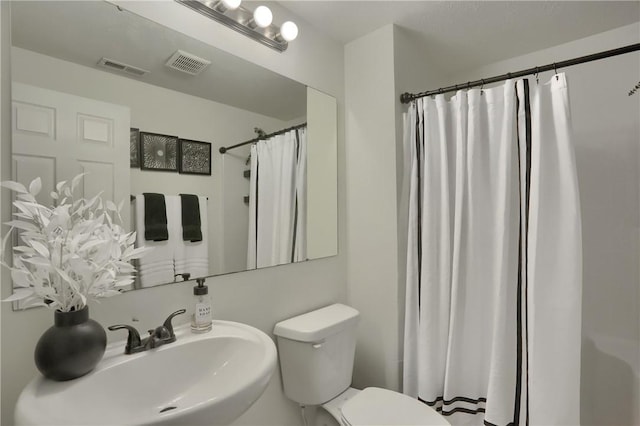 8014 Maureen Dr, Cranberry Twp, PA 16066 - bathroom featuring a sink, toilet, and curtained shower