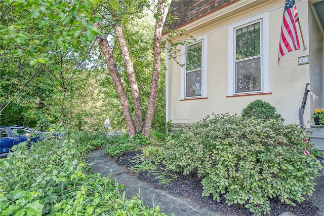 31 Nicholson St, Crafton, PA 15205 - view of property exterior with stucco siding and roof with shingles