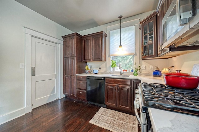 31 Nicholson St, Crafton, PA 15205 - kitchen with appliances with stainless steel finishes, a sink, dark wood-type flooring, light countertops, and glass insert cabinets