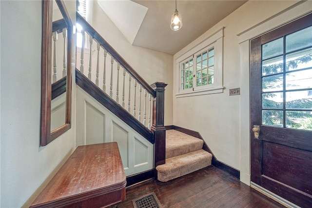 31 Nicholson St, Crafton, PA 15205 - entrance foyer featuring dark wood finished floors, stairway, healthy amount of natural light, and baseboards
