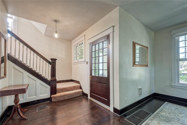 31 Nicholson St, Crafton, PA 15205 - entrance foyer featuring dark wood-type flooring, baseboards, and stairs