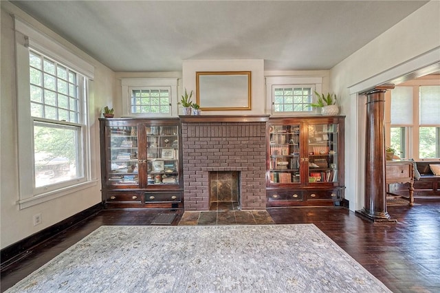 31 Nicholson St, Crafton, PA 15205 - living room featuring wood finished floors, a fireplace, baseboards, and ornate columns