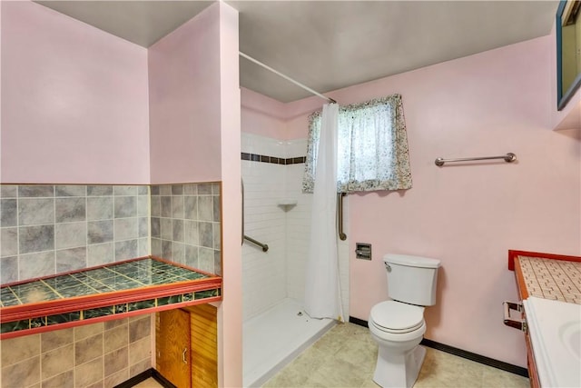 427 Harpers Ferry Rd, North Sewickley Twp, PA 15010 - bathroom with toilet, a stall shower, and baseboards