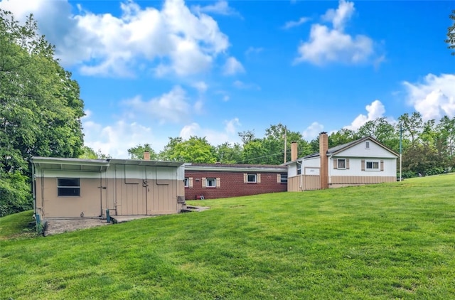 427 Harpers Ferry Rd, North Sewickley Twp, PA 15010 - rear view of house with a yard, a chimney, and an outdoor structure