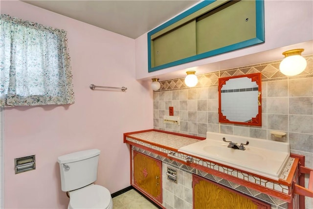 427 Harpers Ferry Rd, North Sewickley Twp, PA 15010 - bathroom featuring vanity, toilet, backsplash, and tile walls