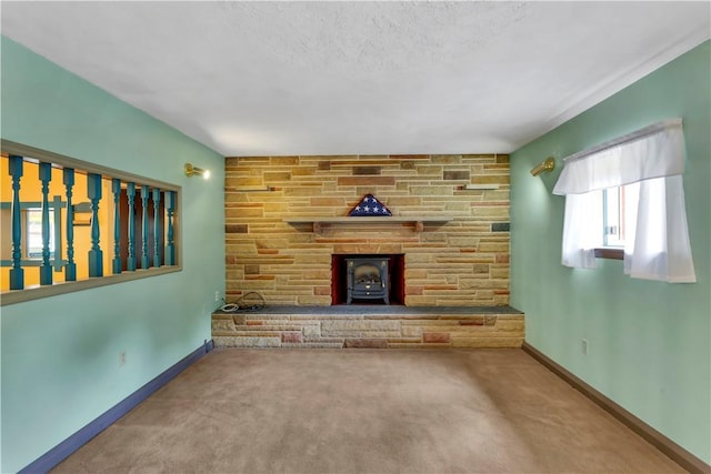 427 Harpers Ferry Rd, North Sewickley Twp, PA 15010 - unfurnished living room with a wood stove, carpet, and baseboards