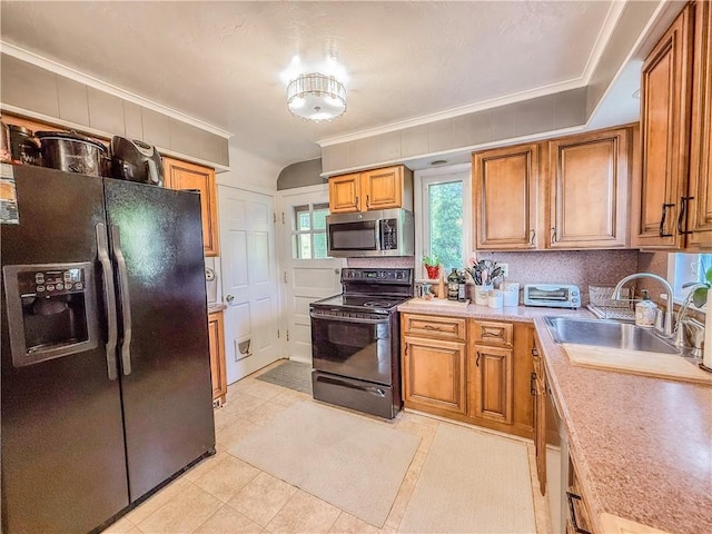 4330 Overhill St, Bethel Park, PA 15102 - kitchen featuring black appliances, a sink, brown cabinets, ornamental molding, and light countertops