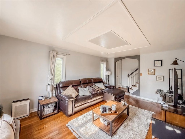 4330 Overhill St, Bethel Park, PA 15102 - living area featuring arched walkways, light wood-style floors, stairway, and baseboards
