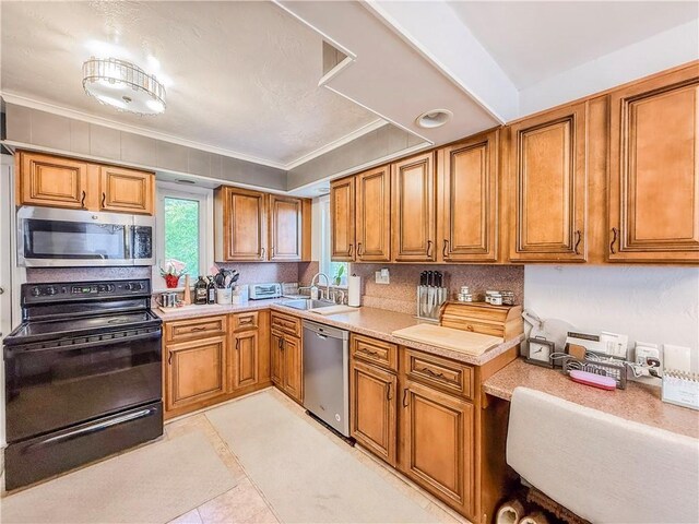 4330 Overhill St, Bethel Park, PA 15102 - kitchen featuring stainless steel appliances, brown cabinetry, a sink, and ornamental molding