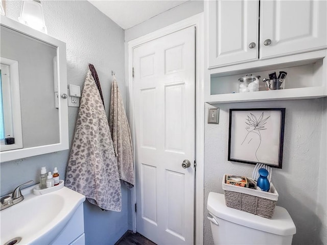 4330 Overhill St, Bethel Park, PA 15102 - bathroom featuring vanity, toilet, and a textured wall
