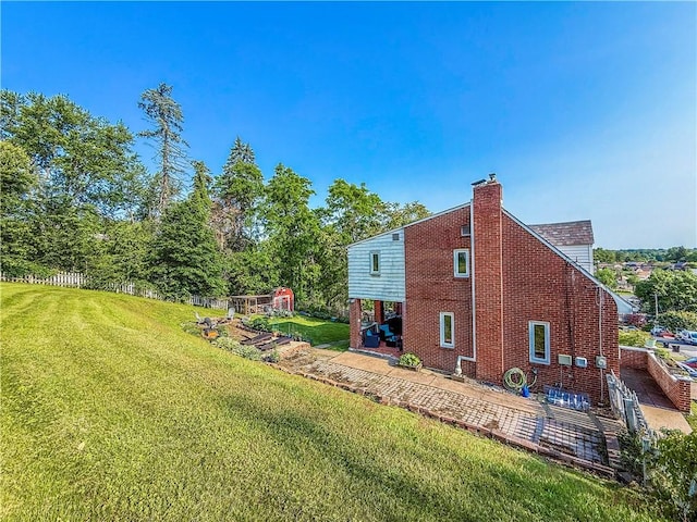 4330 Overhill St, Bethel Park, PA 15102 - view of side of property featuring a lawn, a chimney, and brick siding