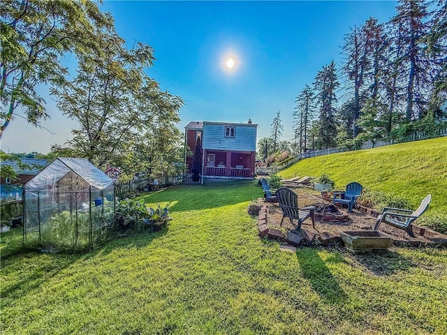 4330 Overhill St, Bethel Park, PA 15102 - view of yard featuring an exterior structure, a fire pit, and an outdoor structure