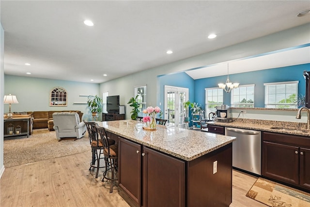 407 Isabella Ct, Zelienople Boro, PA 16063 - kitchen with dishwasher, a sink, dark brown cabinetry, a breakfast bar, and recessed lighting