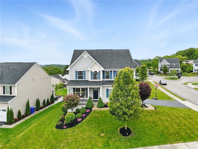 407 Isabella Ct, Zelienople Boro, PA 16063 - traditional home with a porch, a front yard, and roof with shingles