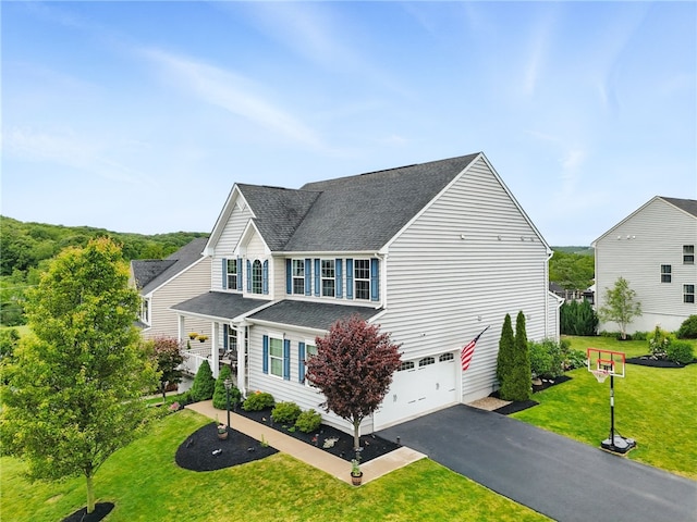 407 Isabella Ct, Zelienople Boro, PA 16063 - view of property exterior with a shingled roof, driveway, an attached garage, and a lawn