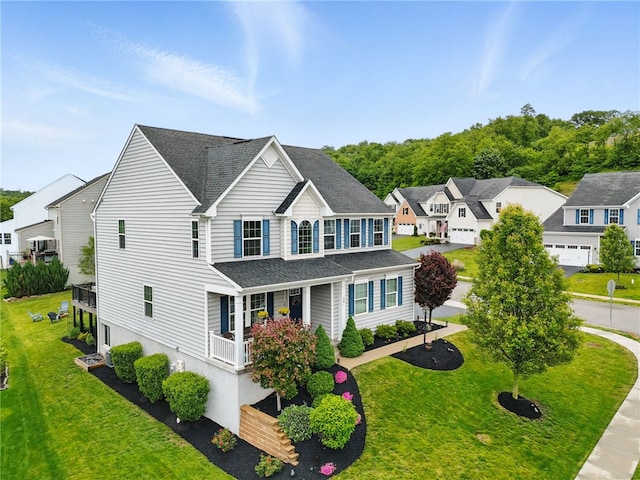 407 Isabella Ct, Zelienople Boro, PA 16063 - traditional-style home featuring covered porch, roof with shingles, a front lawn, and a residential view