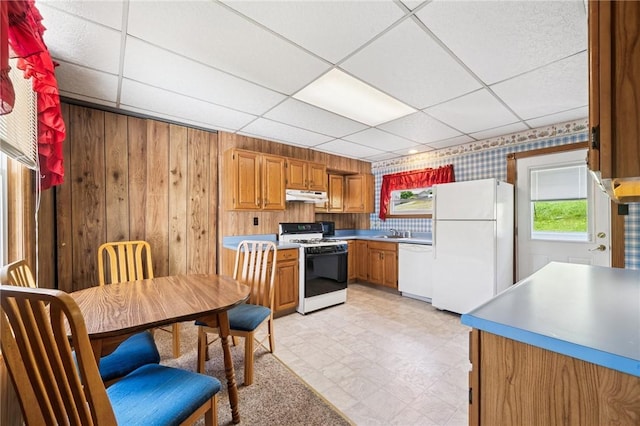 600 Scott St, Penn Twp Wml, PA 15675 - kitchen featuring white appliances, under cabinet range hood, a paneled ceiling, a sink, and light flooring
